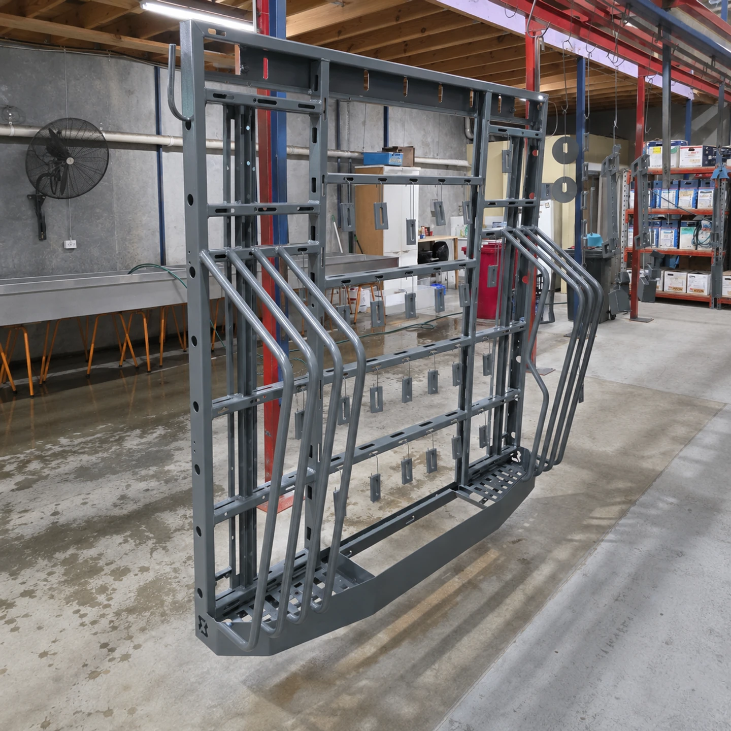 Raw grey fabricated metal assembly before its final powder coat