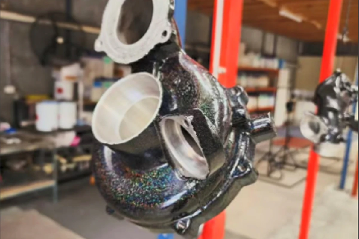 Prepared industrial pump component showing a specialist speckled powder finish